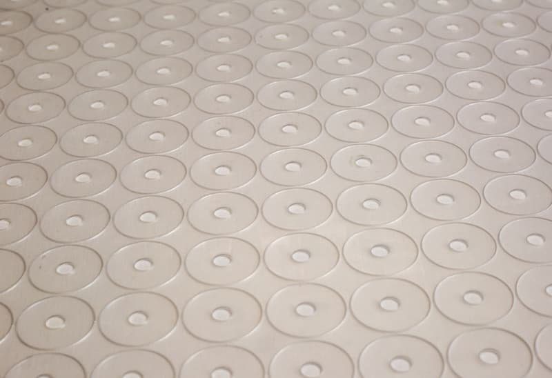 Rows of laser kiss-cut round parts on a release liner