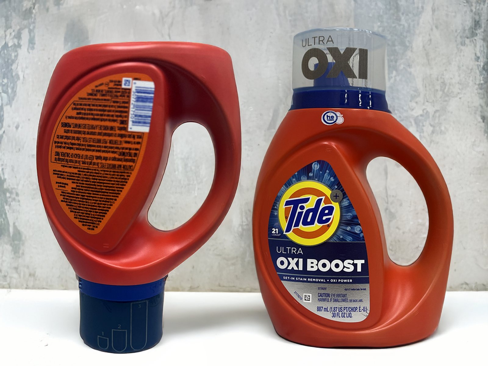 Tide Ultra OXI Boost bottle with a laser-marked back panel