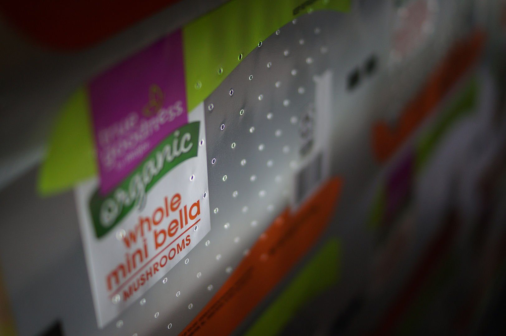 Close-up of laser micro-perforations in printed produce film