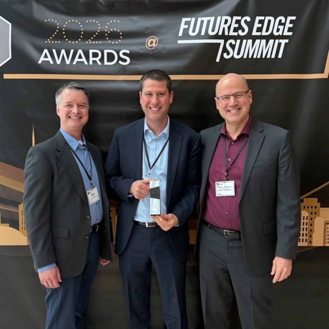 Three people holding the 2026 PAC Global Best in Class award