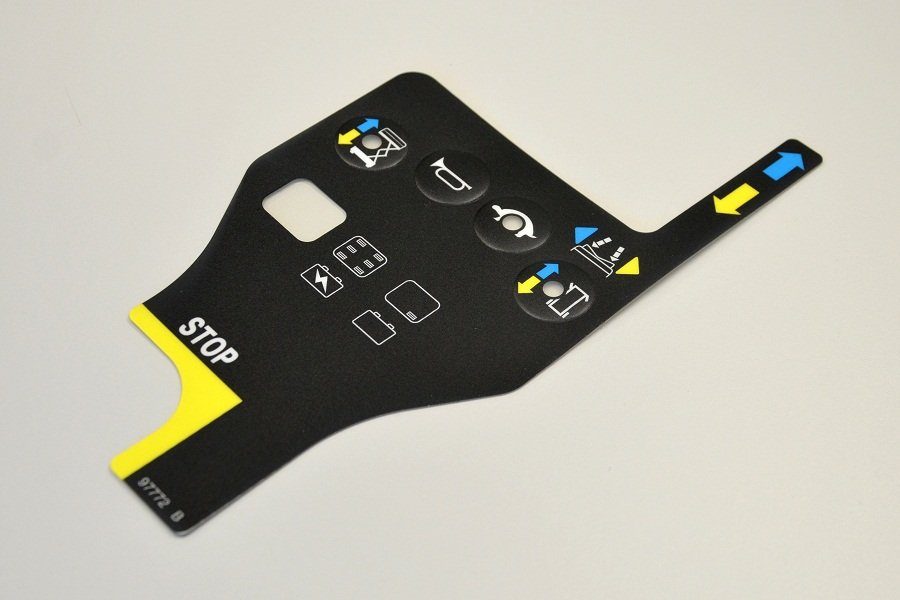 Membrane-switch graphic overlay with laser-cut windows