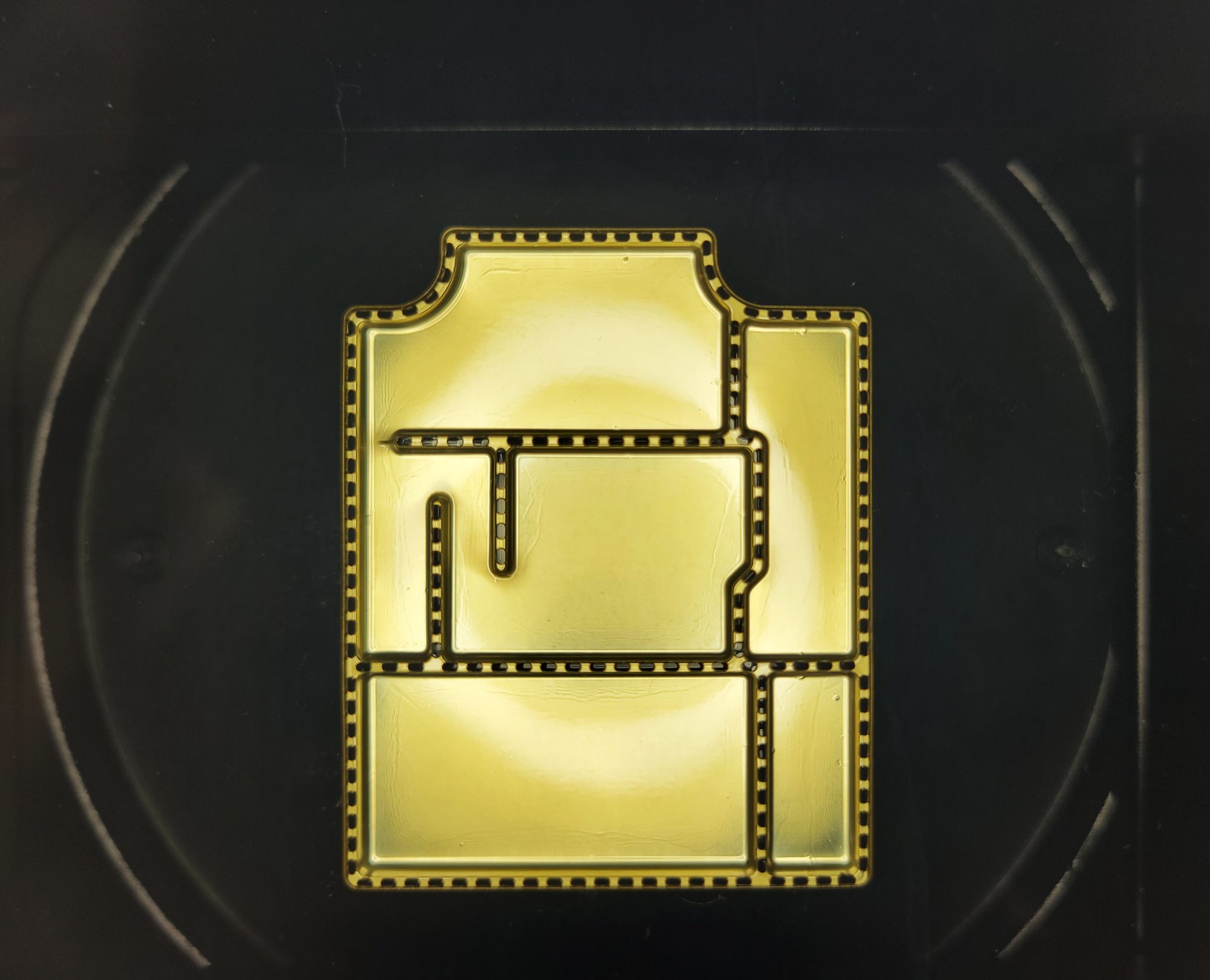 Laser-cut RFI shielding part, backlit