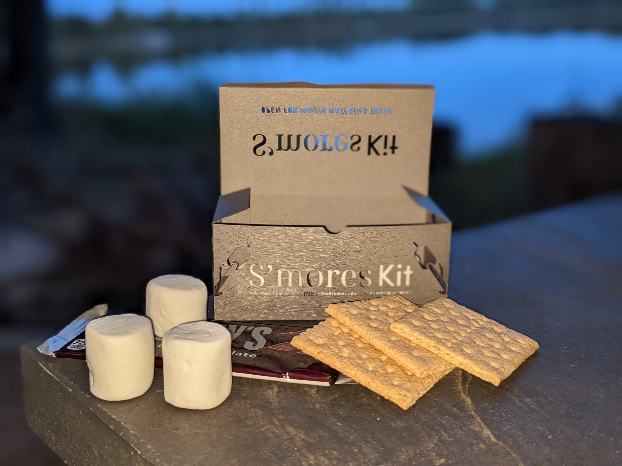 Laser-cut and marked S'mores kit box, open with its contents