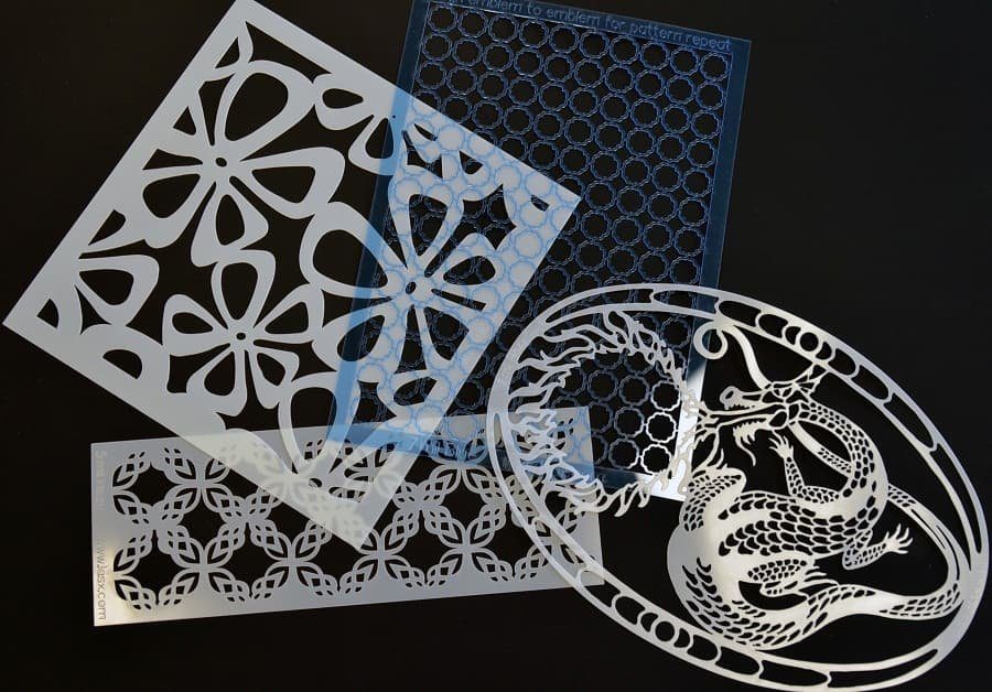 Decorative laser-cut stencil panels on black
