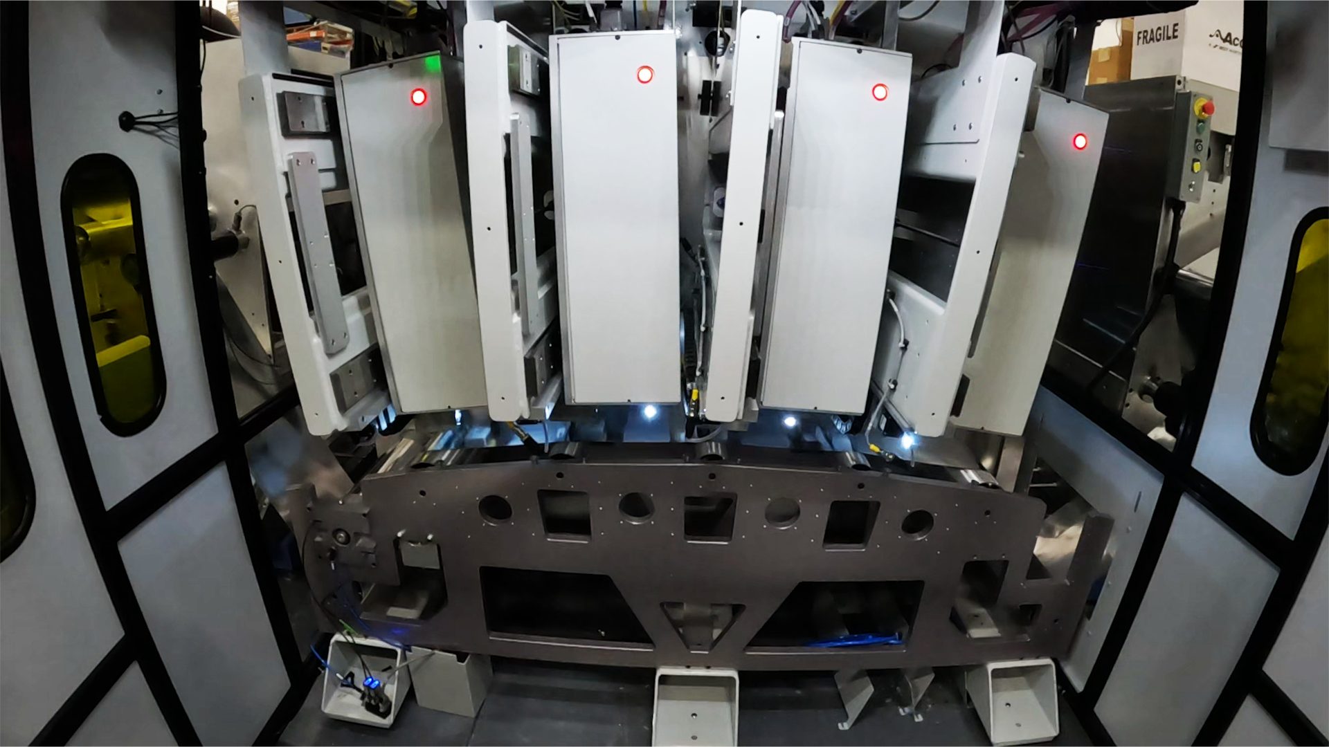 Bank of four LaserSharp processing modules in a roll-to-roll foil ablation system